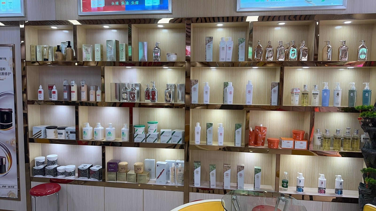 Display shelves of finished shampoo and haircare products in a Chinese cosmetics factory